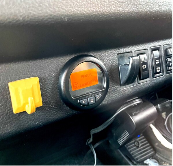 The Optimus Technologies Vector System user interface and fuel gauge provides drivers with real-time visibility and control of 100% biodiesel (B100) operation - shown here on a Hino truck undergoing testing in Japan in collaboration with Mitsui & Co. The Optimus Technologies Vector System user interface and fuel gauge provides drivers with real-time visibility and control of 100% biodiesel (B100) operation - shown here on a Hino truck undergoing testing in Japan in collaboration with Mitsui & Co.