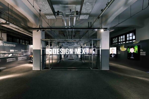 Entrance installation of DESIGN NEXT, the 2025 Taiwan Design Week exhibition, featuring illuminated typography and linear structures that lead visitors into a journey exploring the future of design.