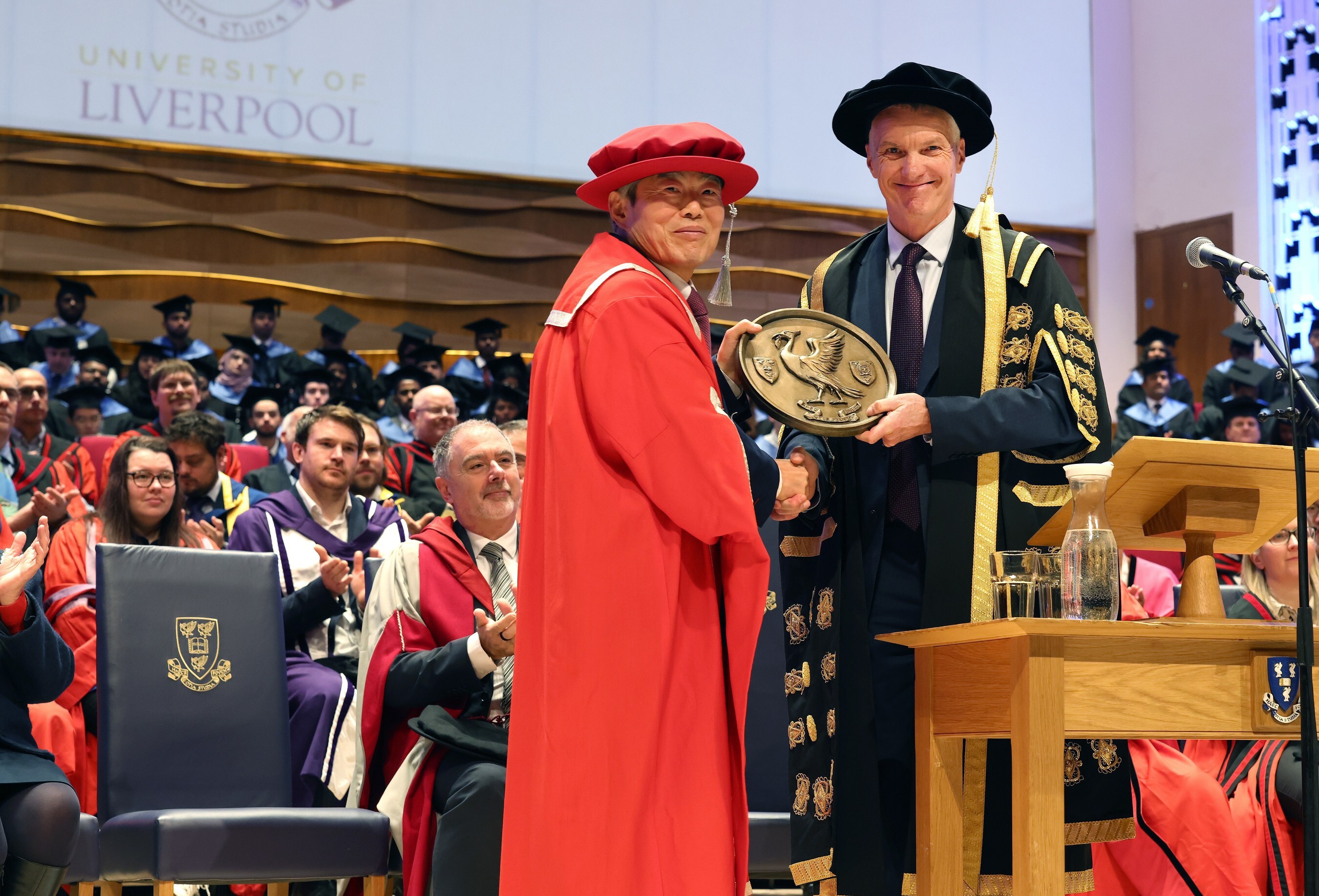 Professor Youmin Xi (left) and Professor Tim Jones at the ceremony