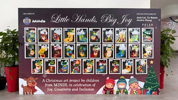 A festive display of 29 handmade Christmas socks by MINDS Raintree SSCC students at Fernvale CC