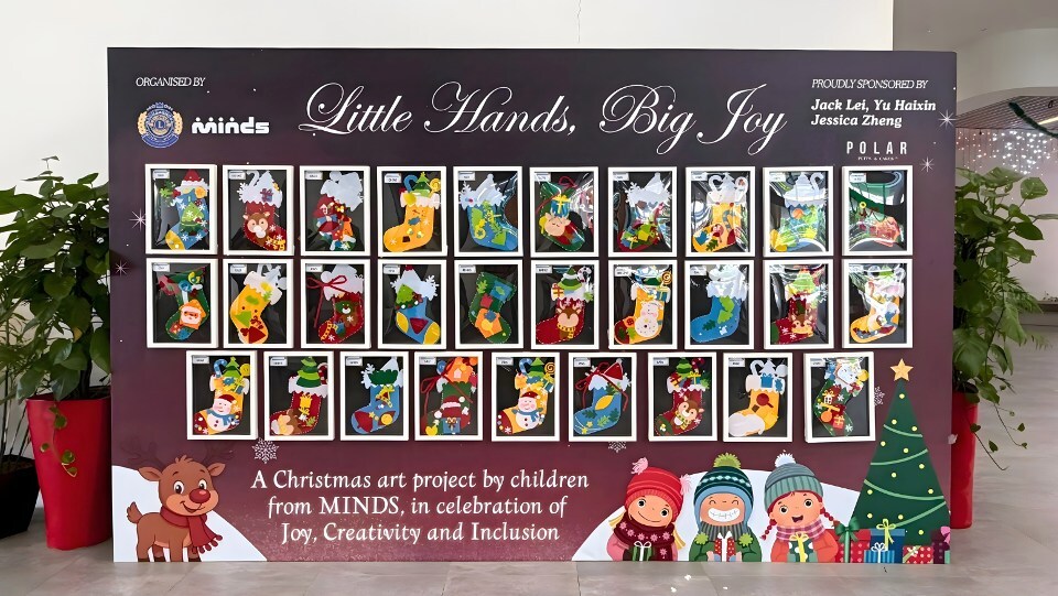 A festive display of 29 handmade Christmas socks by MINDS Raintree SSCC students at Fernvale CC