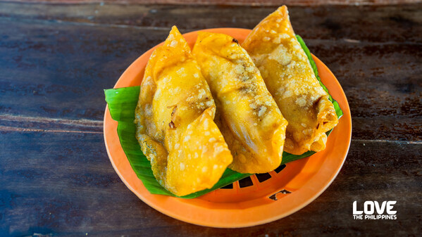 The viral Ilocos Empanada has long been a hit for locals and tourists in the Philippines for its crunchy outer shell and savory filling made with a local sausage called longganisa, shredded green papaya, mung beans, and whole egg. Ilocos Empanada, Vigan Plaza, Vigan, Ilocos Sur, Philippines  | Courtesy of Department of Tourism