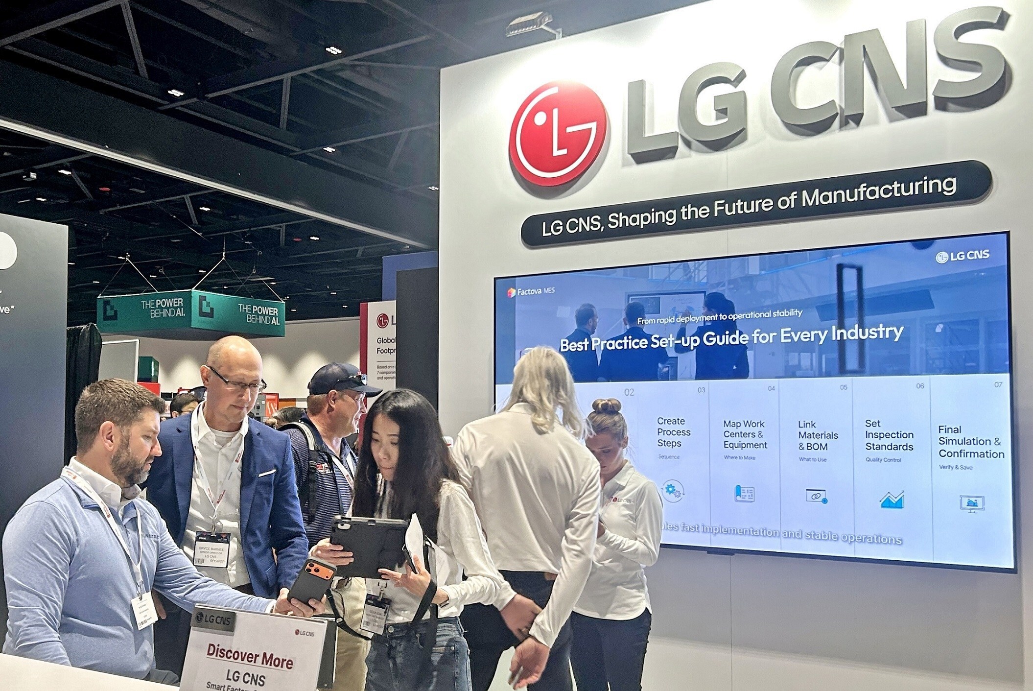 Visitors at the LG CNS booth listening to an explanation of the AI smart factory solution ‘Factova’ during 'IoT Tech Expo 2026', held in San Jose, California, on May 18–19